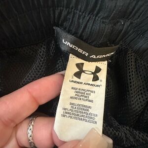 Adult Under Armour wind pants size medium, some wear show in pictures.